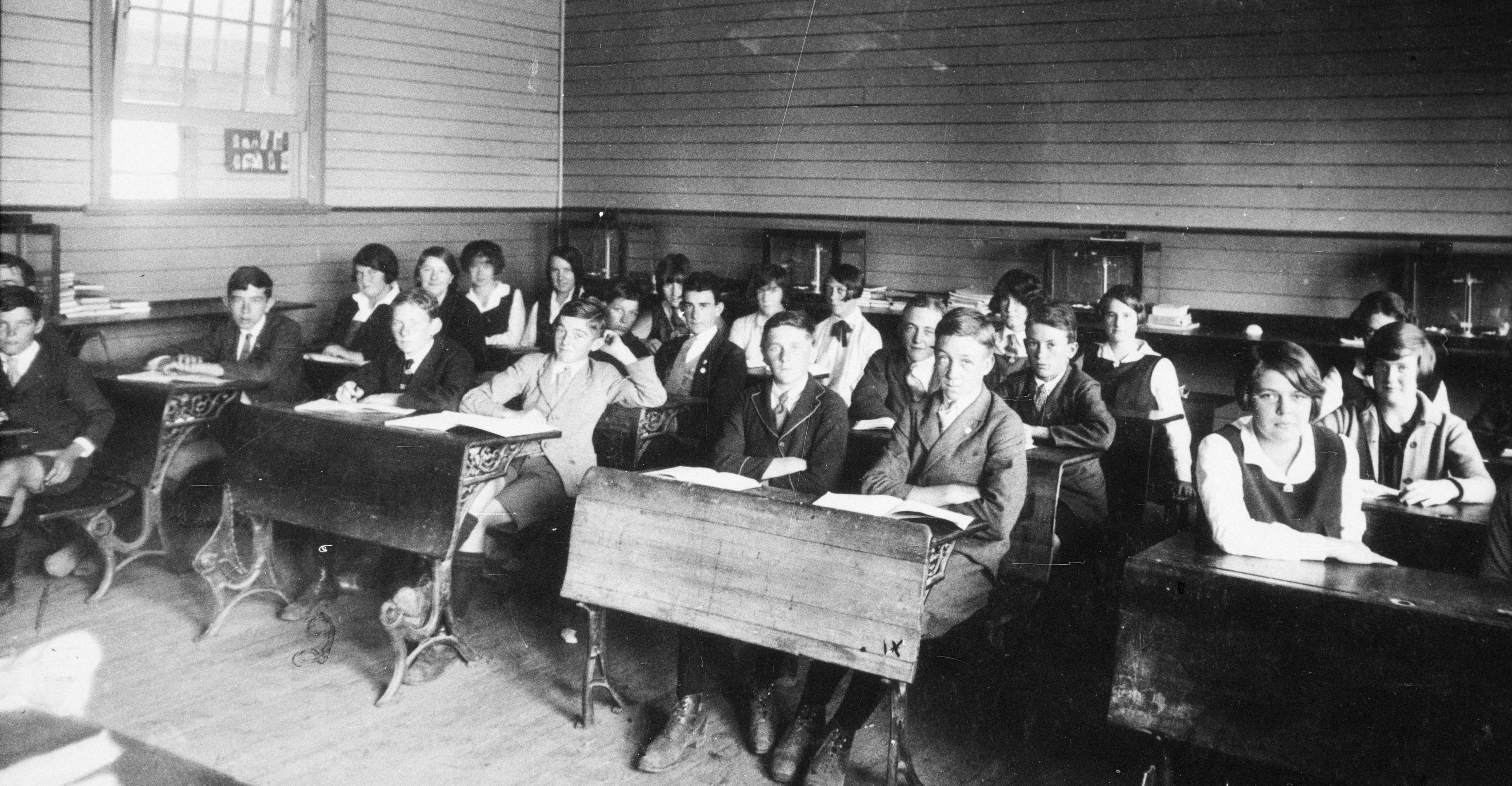Adolescents coralled in classrooms, Deniliquen Intermediate High School, c 1935. State Library of New South Wales.