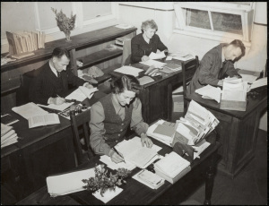 Blackfriars teachers busy at work. From the Commonwealth Film Unit production “School in the Mailbox”, directed by Stanley Hawes. Digital ID: 15051_a047_003382.jpg; c. 01/01/1946 © State of New South Wales through the State Records Authority of NSW 